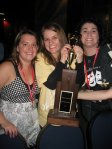 Heather Taft, Mary Katherine Smith, and Ann Mahoney Kadar pose with the Freddie G. trophy.